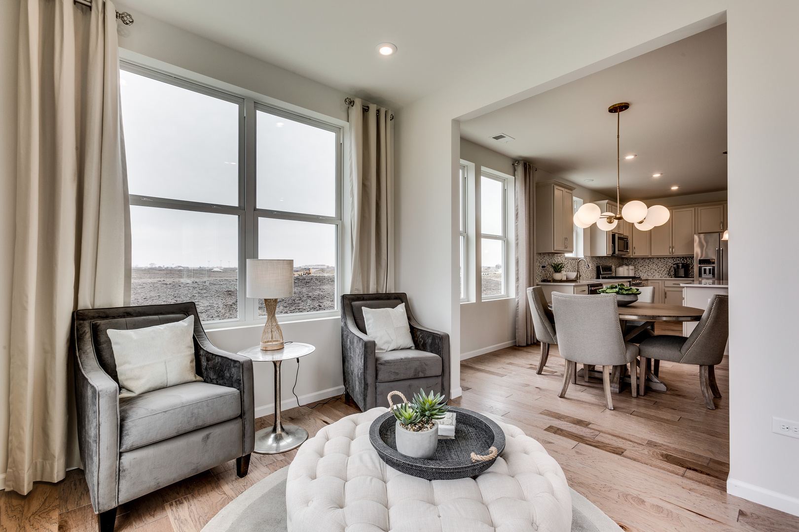 825 Spring Drive Lindenhurst, IL 60046 - Photo 10 of 29 a living room with furniture dining table and a large window