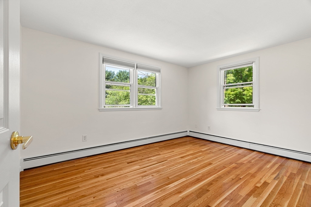 2 Mark Street Manchester, MA 01944 - Photo 15 of 33 a view of an empty room with wooden floor and a window