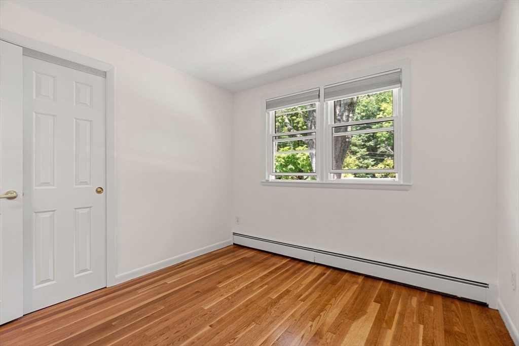 2 Mark Street Manchester, MA 01944 - Photo 16 of 33 an empty room with wooden floor and windows