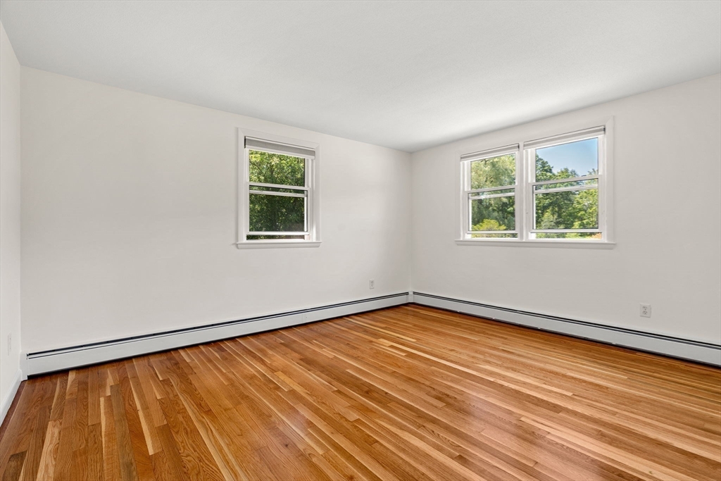2 Mark Street Manchester, MA 01944 - Photo 17 of 33 a view of an empty room with wooden floor and a window