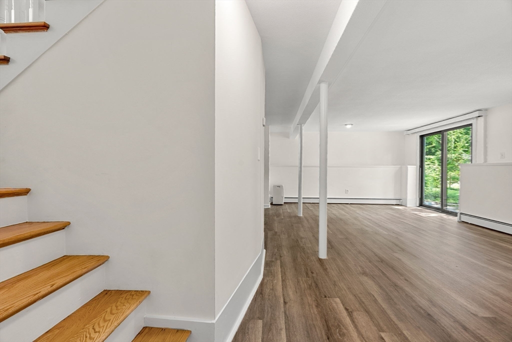 2 Mark Street Manchester, MA 01944 - Photo 21 of 33 wooden floor in an empty room with a window