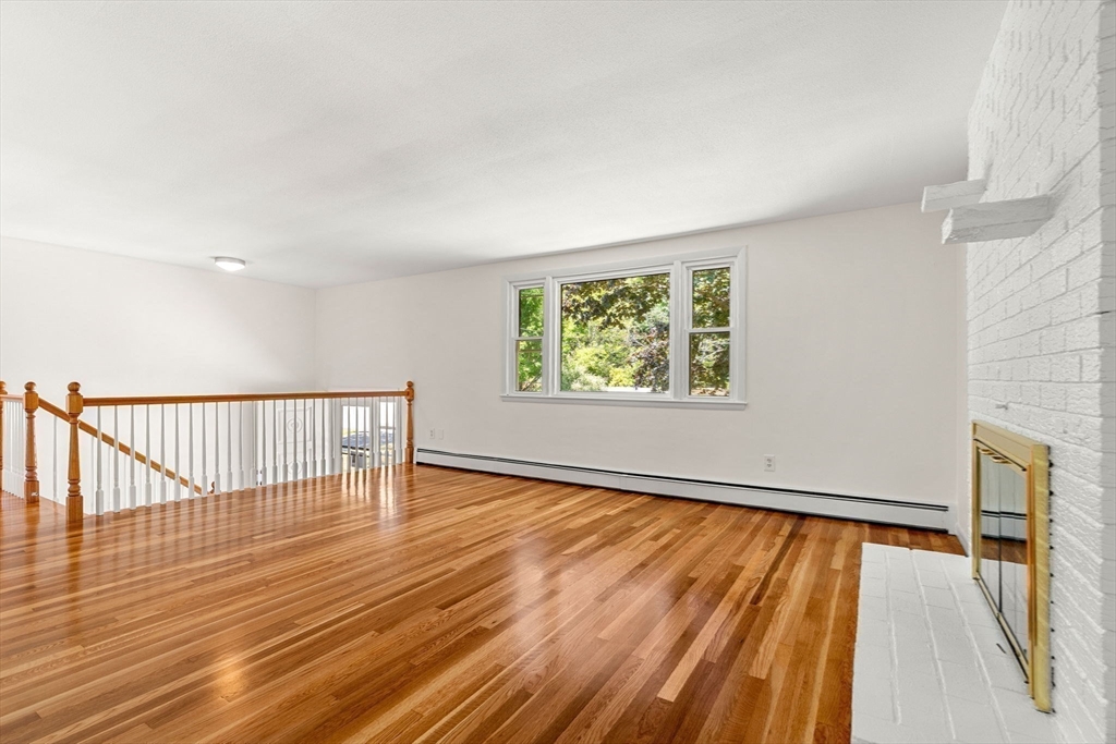 2 Mark Street Manchester, MA 01944 - Photo 9 of 33 a view of an empty room with wooden floor and a window