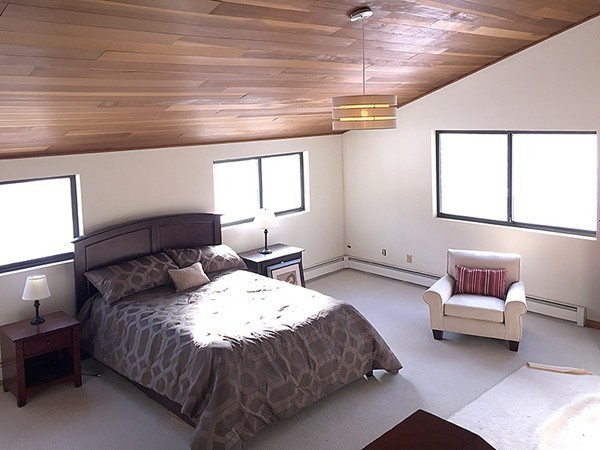 318 Stow Road Harvard, MA 01451 - Photo 5 of 16 a spacious bedroom with a bed and a couch