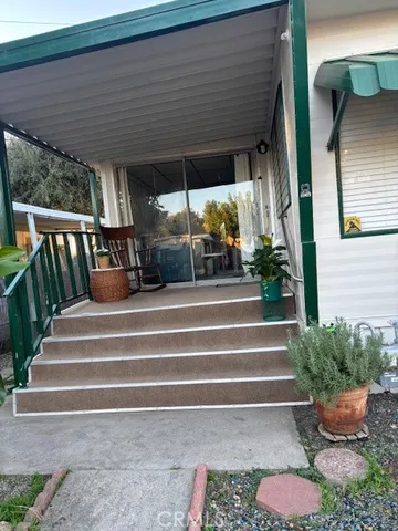 a view of backyard with seating space