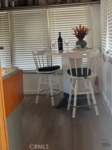 a front view of a house with a large window