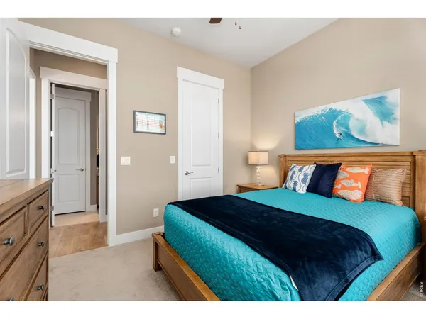 a bedroom with a bed and a night stand