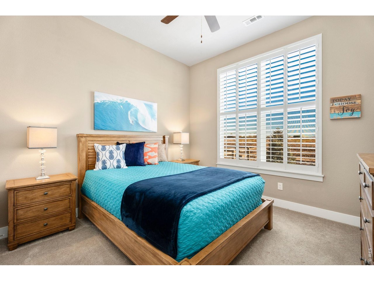 1030 Larimer Ridge Parkway Timnath, CO 80547 - Photo 18 of 38 a bedroom with a bed and a night stand