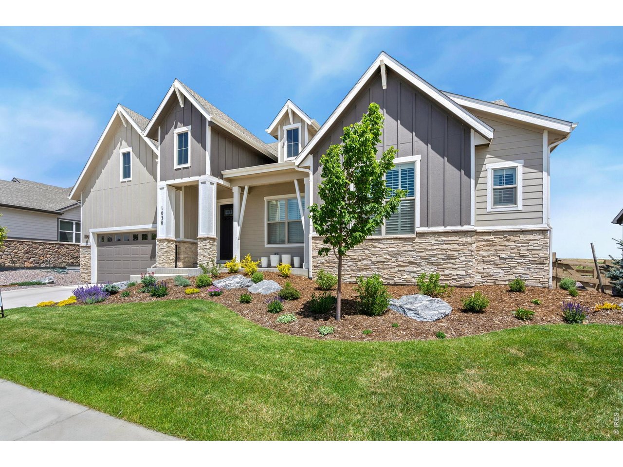 1030 Larimer Ridge Parkway Timnath, CO 80547 - Photo 2 of 38 a front view of house with yard and green space
