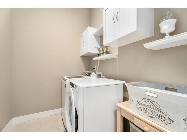 a bedroom with a large bed and a large window