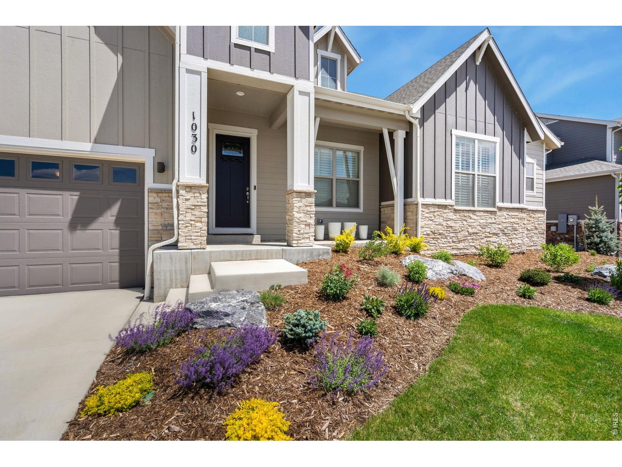 1030 Larimer Ridge Parkway Timnath, CO 80547 - Photo 3 of 38 a front view of a house with a yard