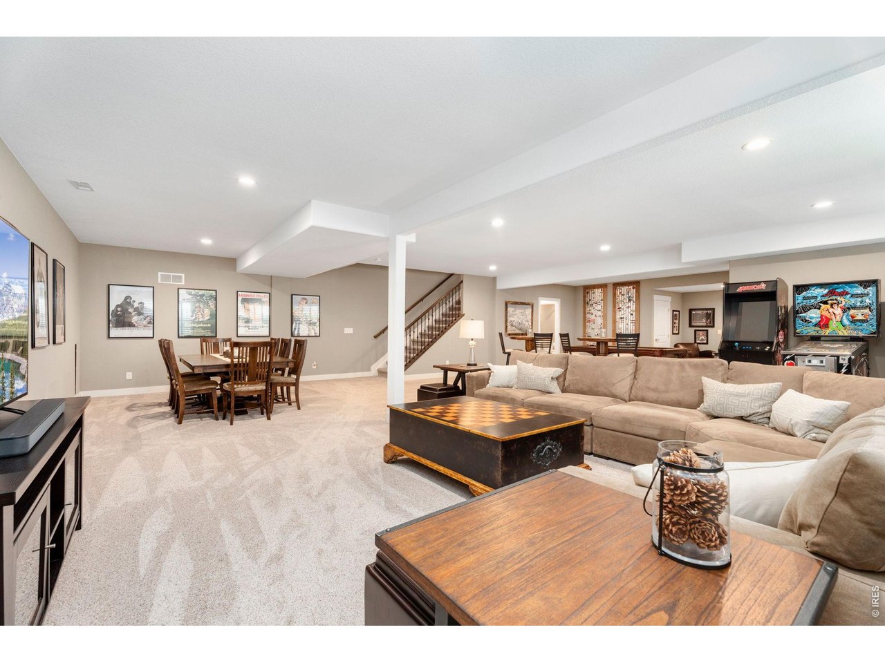 1030 Larimer Ridge Parkway Timnath, CO 80547 - Photo 32 of 38 a living room with furniture and wooden floor