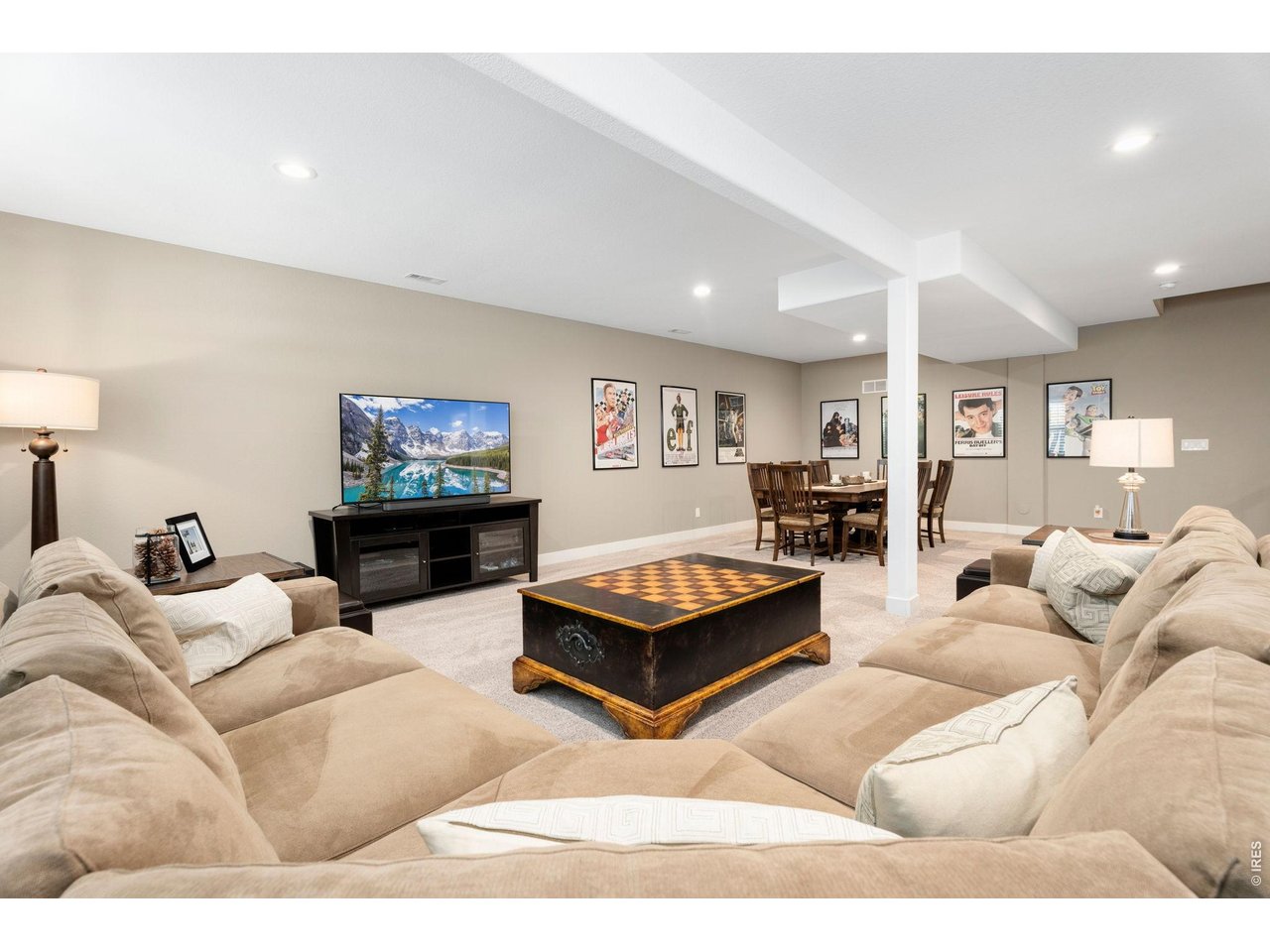 1030 Larimer Ridge Parkway Timnath, CO 80547 - Photo 34 of 38 a living room with furniture and a flat screen tv