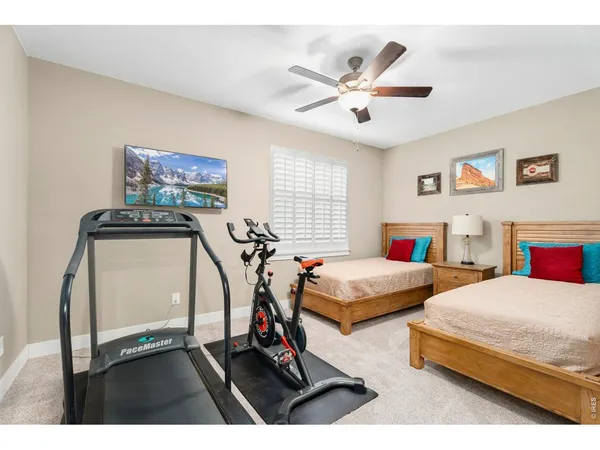 a bathroom with a sink toilet vanity and shower