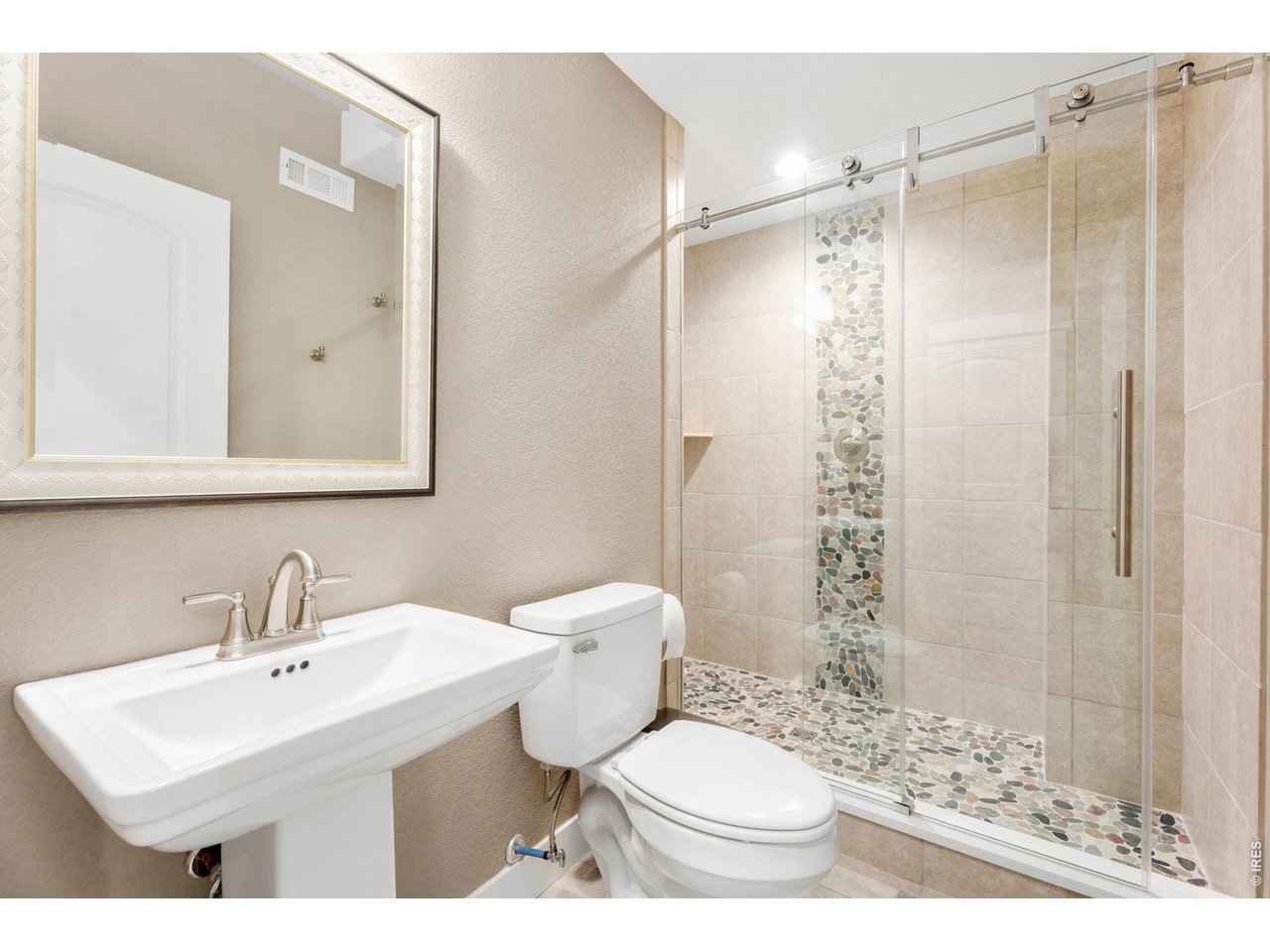 1030 Larimer Ridge Parkway Timnath, CO 80547 - Photo 38 of 38 a bathroom with a sink toilet vanity and shower