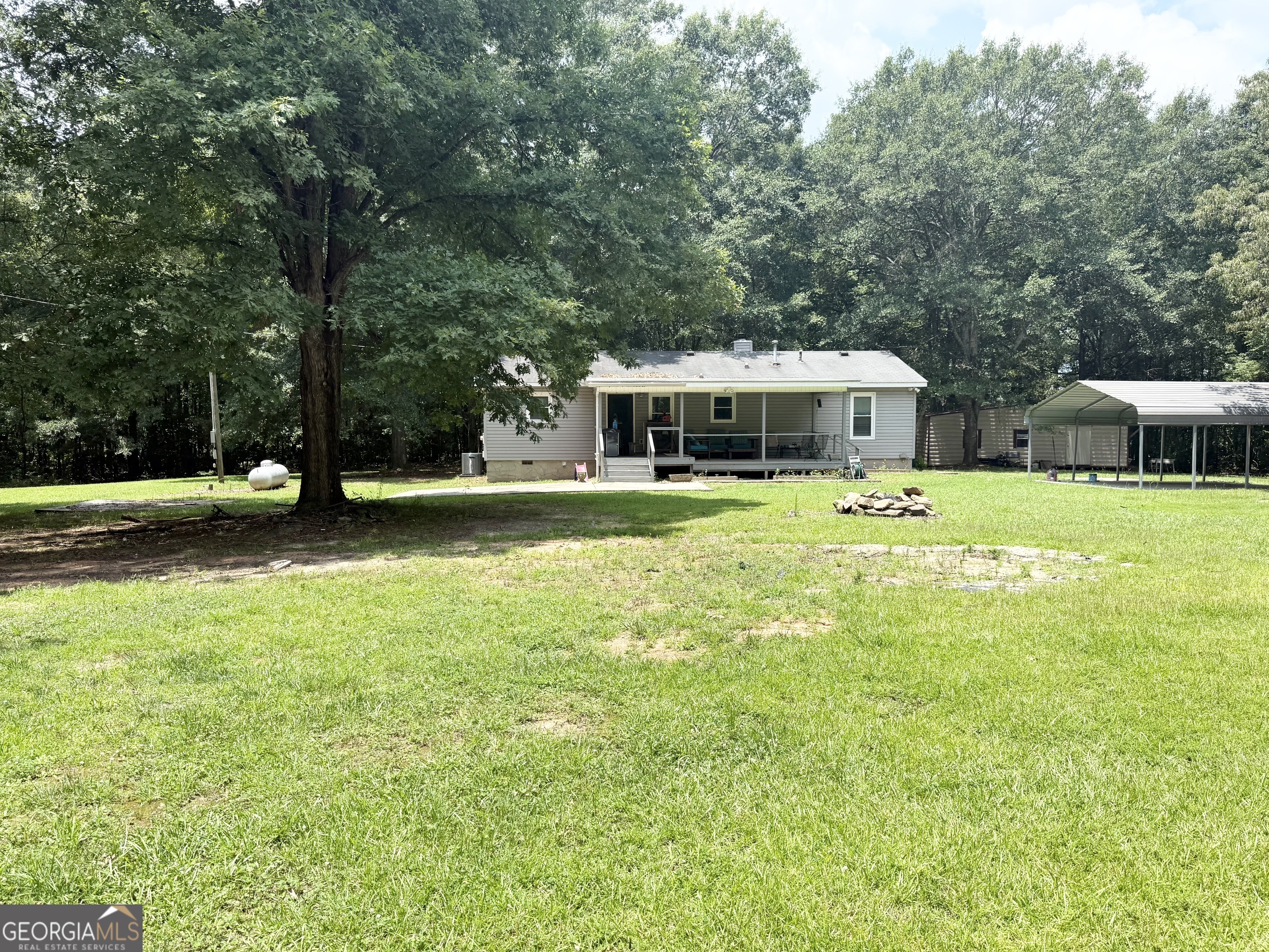 62 Melvin Harris Road Manchester, GA 31816 - Photo 48 of 52 a view of an house with swimming pool and chairs