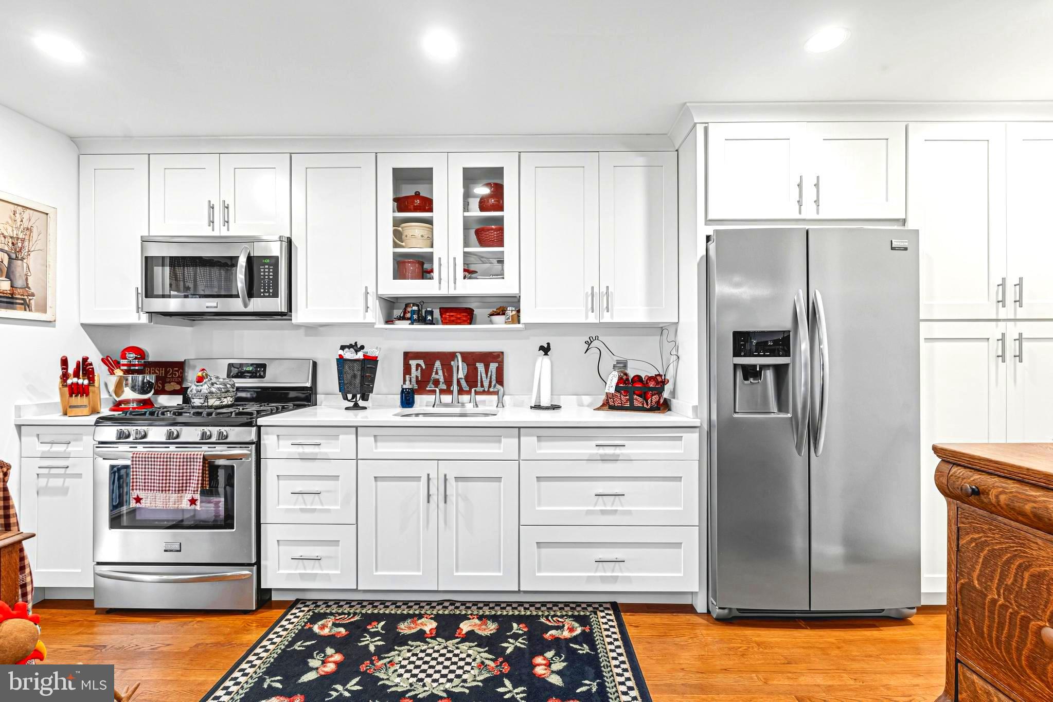 7815 Rockbourne Road Baltimore, MD 21222 - Photo 1 of 39 a kitchen with stainless steel appliances a refrigerator sink and microwave