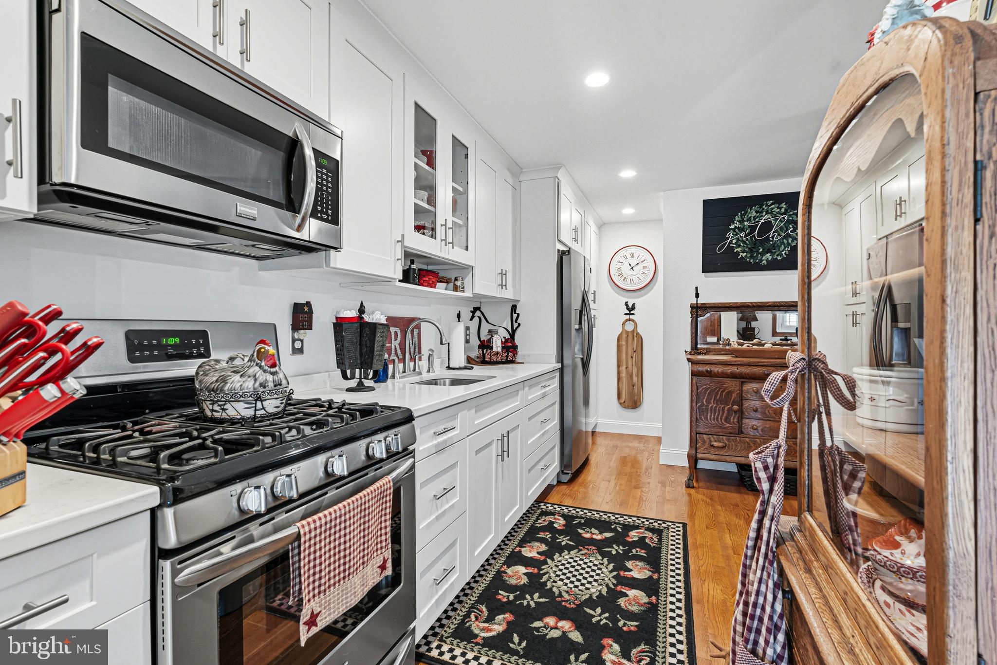 7815 Rockbourne Road Baltimore, MD 21222 - Photo 12 of 39 a kitchen with stainless steel appliances granite countertop a stove and a microwave