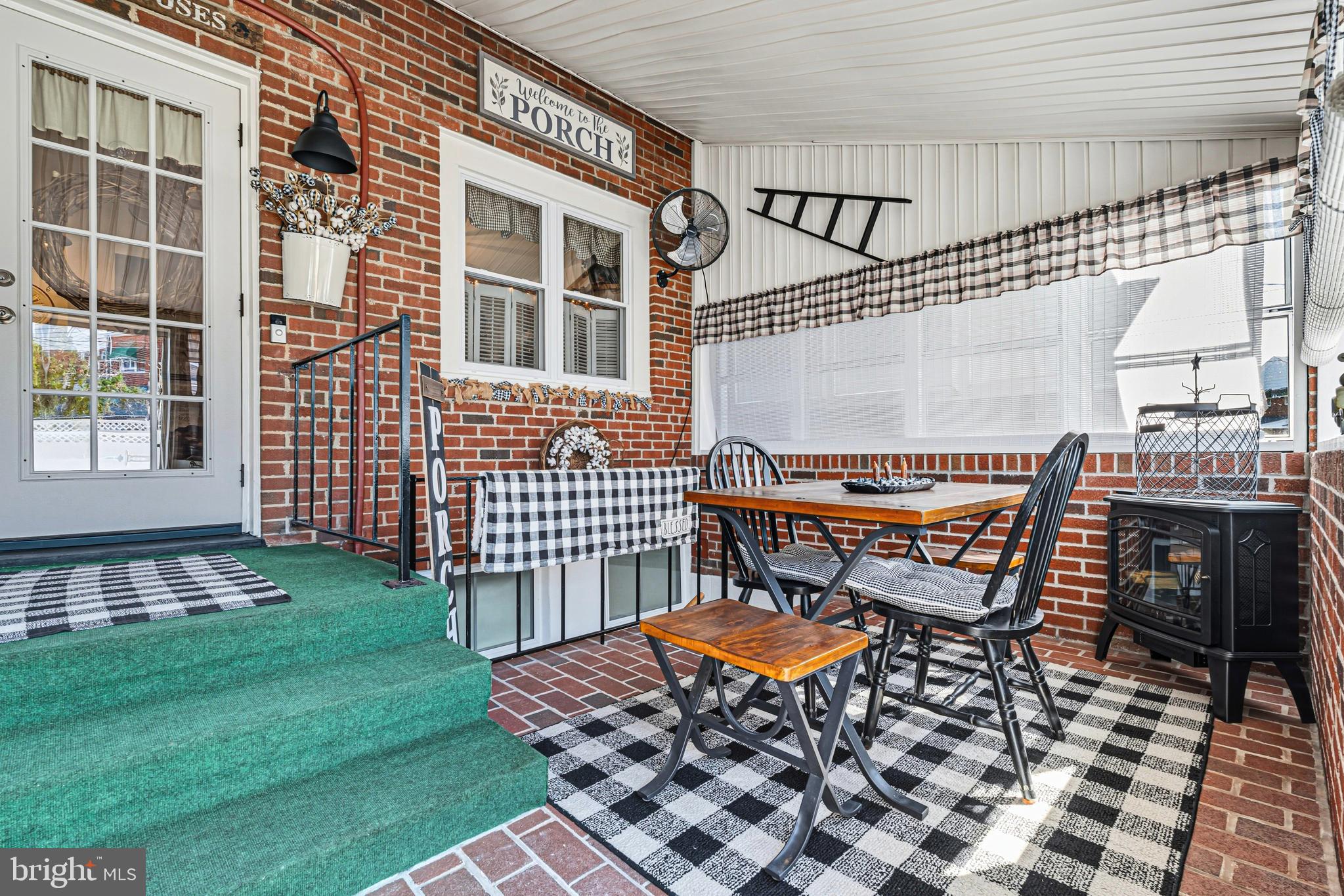 7815 Rockbourne Road Baltimore, MD 21222 - Photo 17 of 39 a backyard of a house with barbeque oven table and chairs