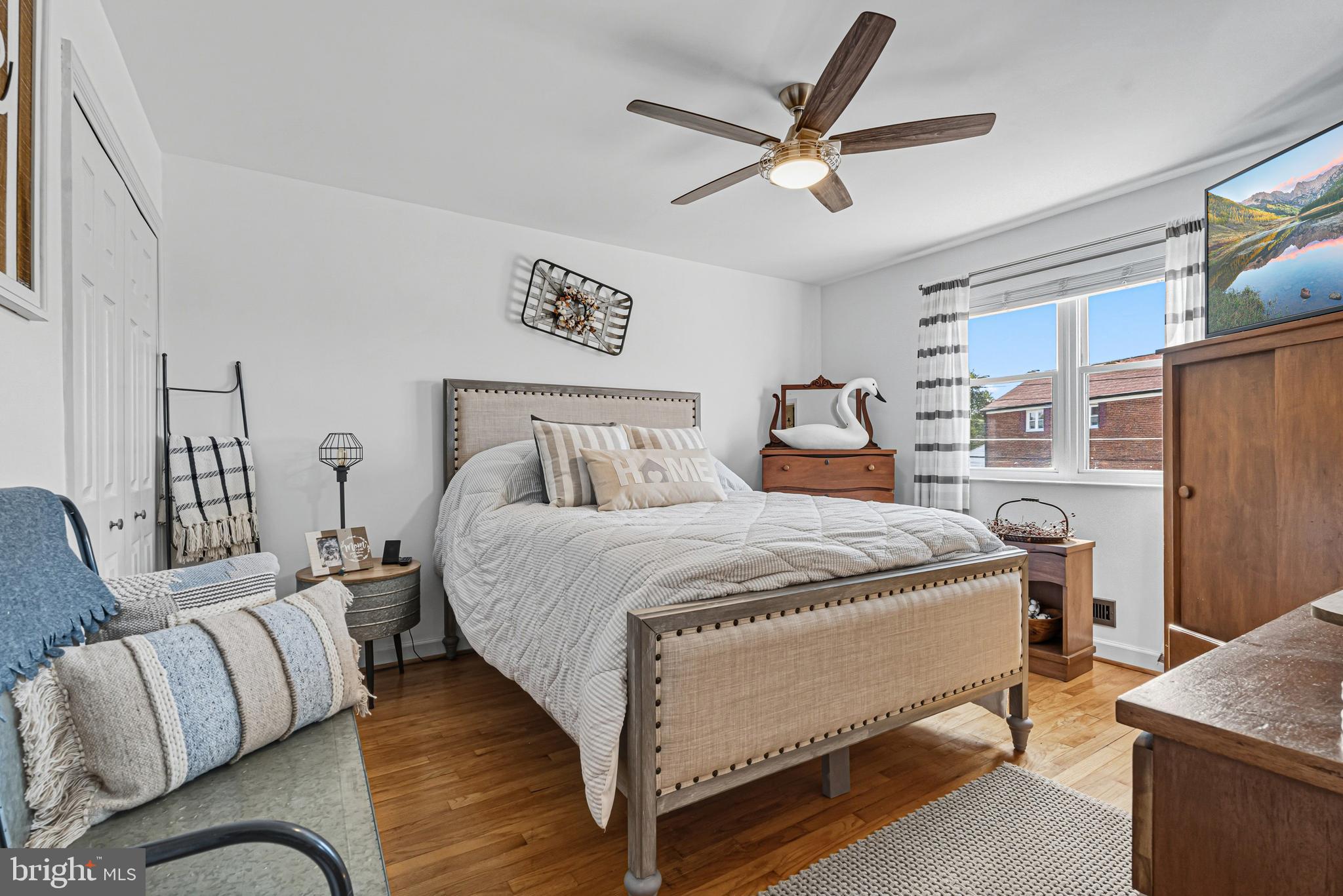 7815 Rockbourne Road Baltimore, MD 21222 - Photo 21 of 39 a bedroom with a bed couch and a window