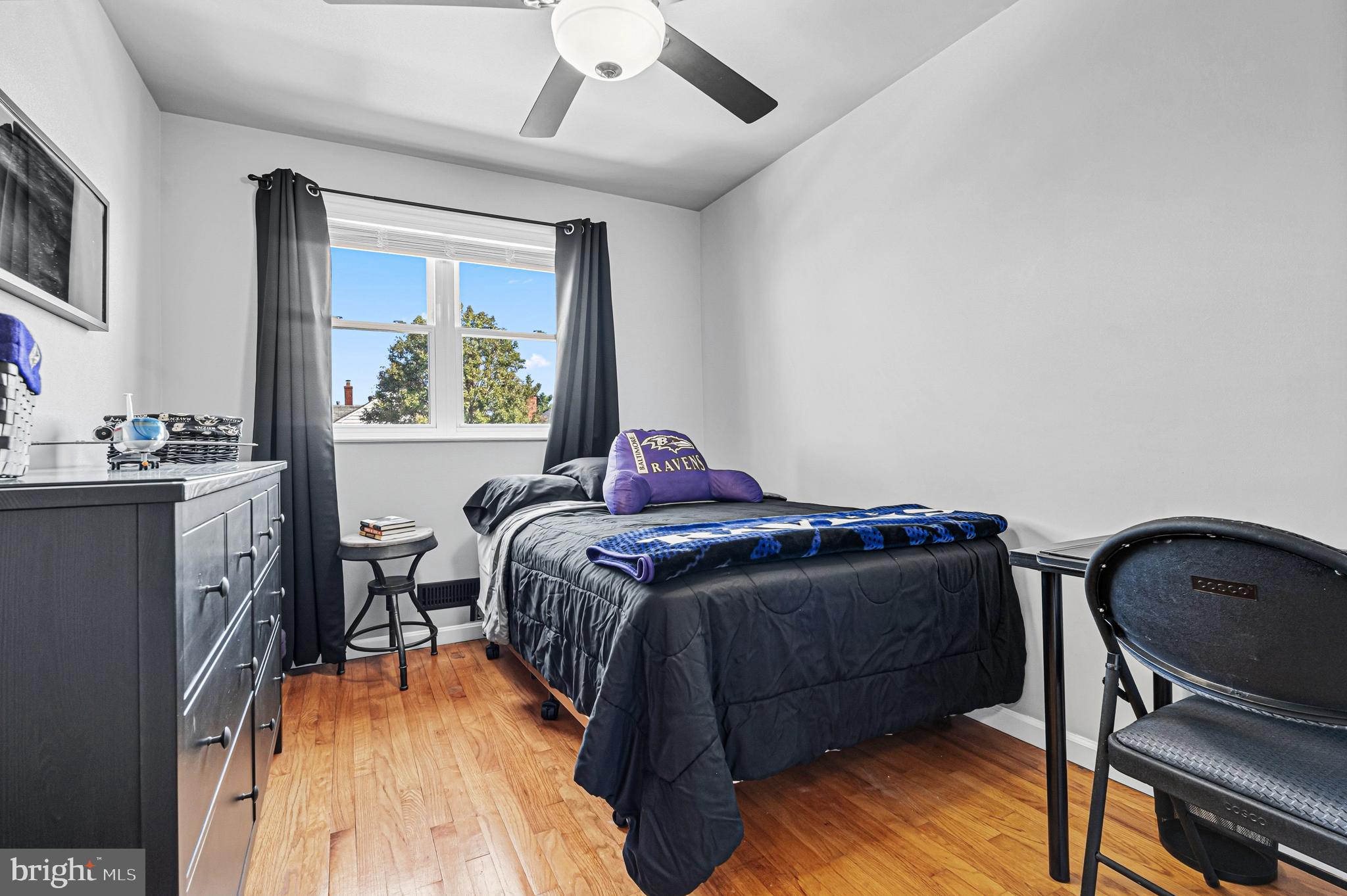 7815 Rockbourne Road Baltimore, MD 21222 - Photo 25 of 39 a bedroom with a bed and a window