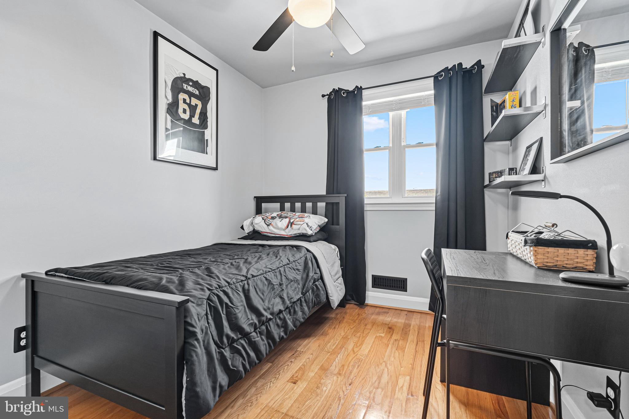 7815 Rockbourne Road Baltimore, MD 21222 - Photo 27 of 39 a bedroom with a bed and painting on the wall
