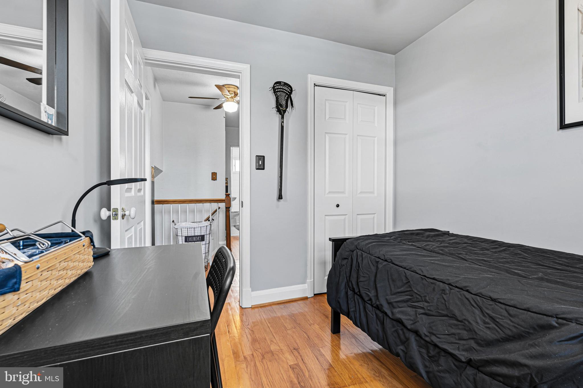 7815 Rockbourne Road Baltimore, MD 21222 - Photo 28 of 39 a bedroom with a bed next to a window with the dresser