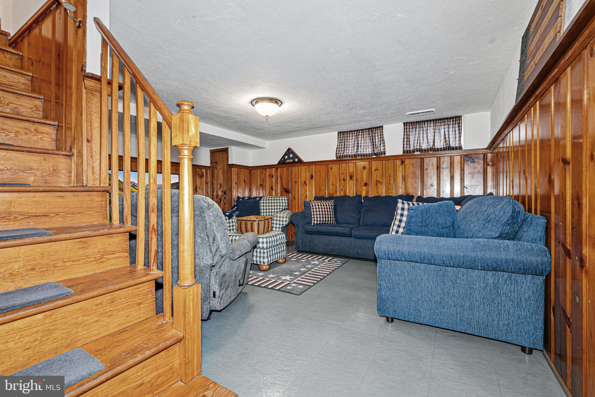 7815 Rockbourne Road Baltimore, MD 21222 - Photo 29 of 39 a living room with furniture and a ceiling fan