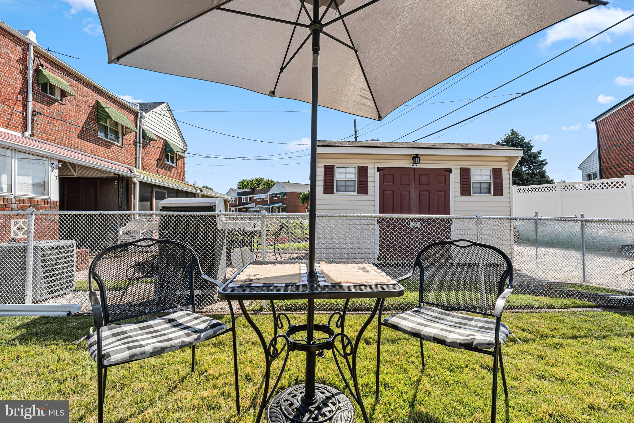 7815 Rockbourne Road Baltimore, MD 21222 - Photo 36 of 39 a patio with table and chairs and potted plants