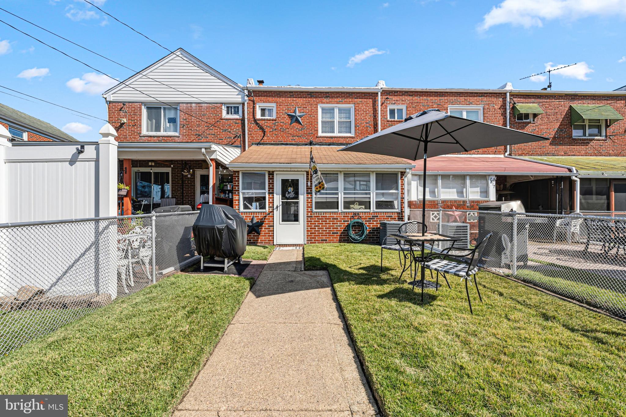7815 Rockbourne Road Baltimore, MD 21222 - Photo 38 of 39 a view of a patio with chairs and a table