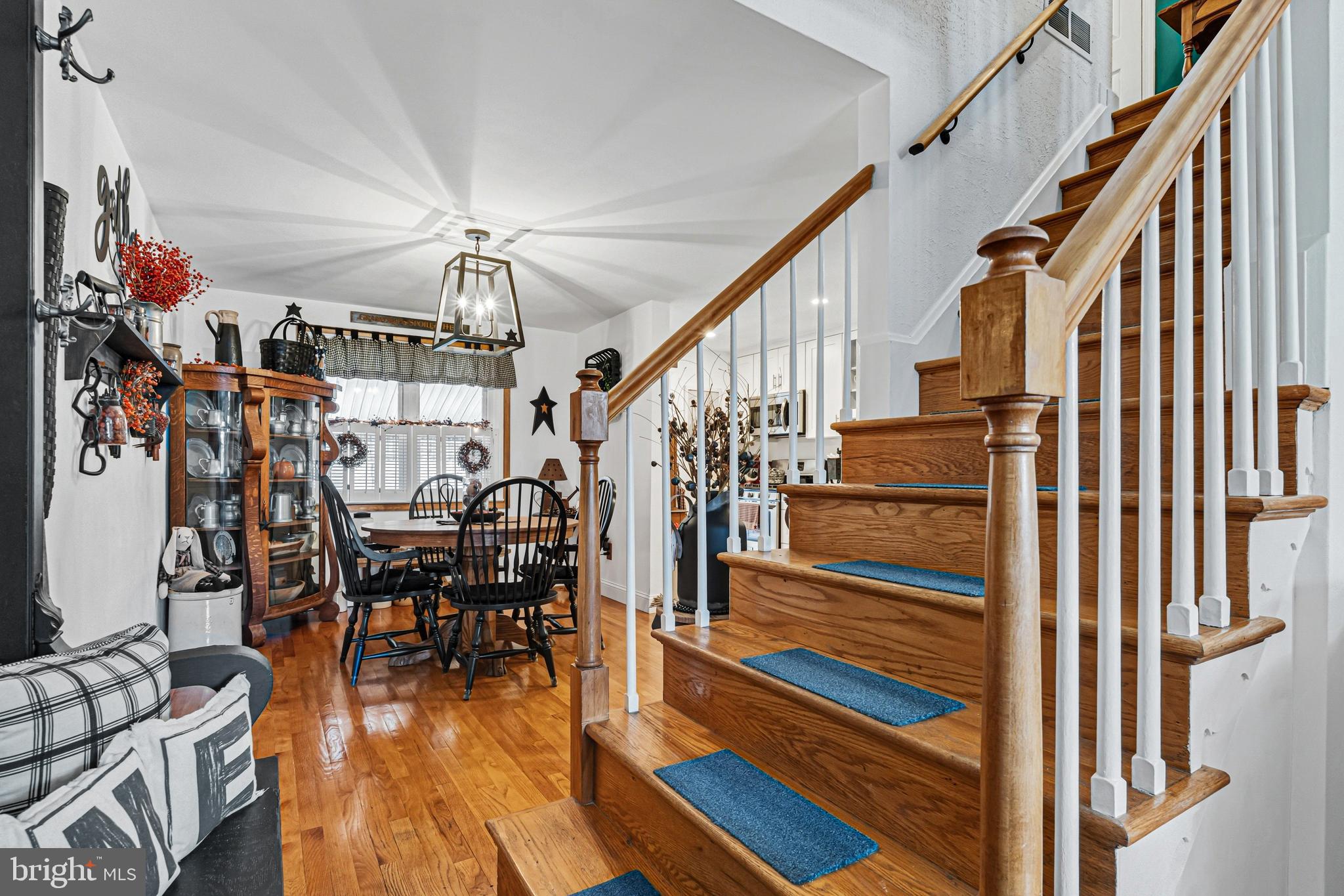 7815 Rockbourne Road Baltimore, MD 21222 - Photo 8 of 39 a view of entryway dining room and hall with wooden floor