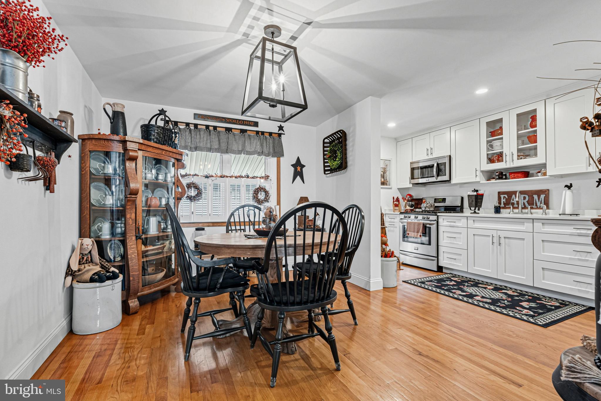 7815 Rockbourne Road Baltimore, MD 21222 - Photo 10 of 39 a view of a dining room with furniture and wooden floor