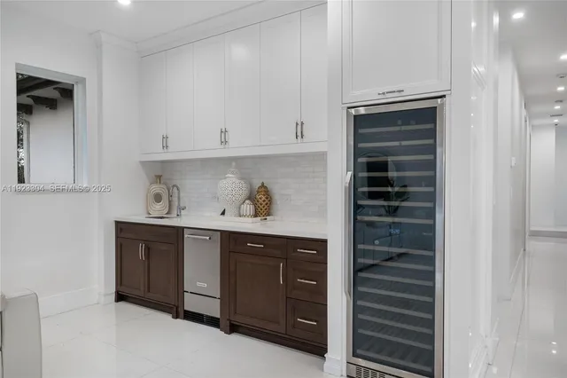 a view of walk in closet with wooden floor