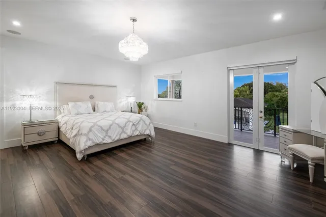 a bedroom with double bed and a window