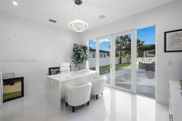an aerial view of a house with swimming pool garden and patio