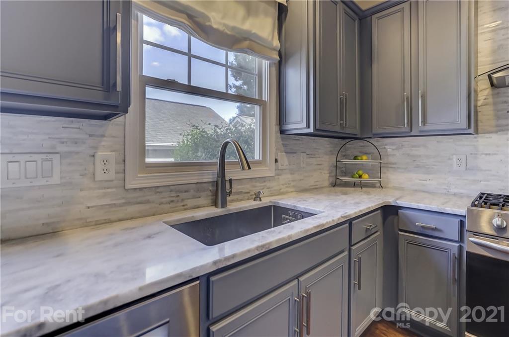 1033 Market Street Fort Mill, SC 29708 - Photo 14 of 46 a kitchen with a sink and cabinets
