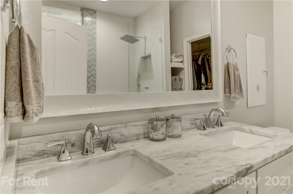 1033 Market Street Fort Mill, SC 29708 - Photo 21 of 46 a bathroom with double vanity sinks and a mirror