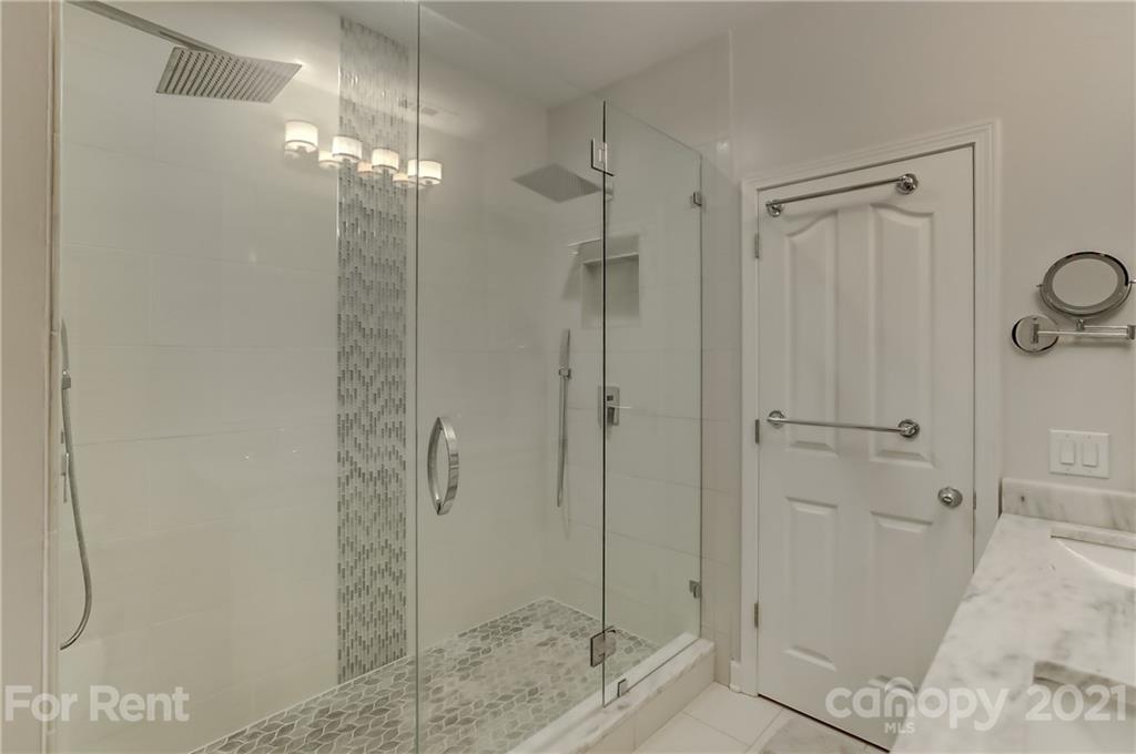 1033 Market Street Fort Mill, SC 29708 - Photo 22 of 46 a bathroom with a granite countertop sink mirror and shower