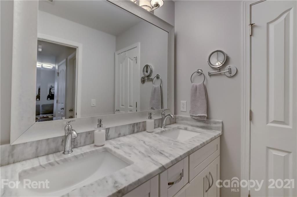 1033 Market Street Fort Mill, SC 29708 - Photo 28 of 46 a bathroom with a granite countertop sink and a mirror