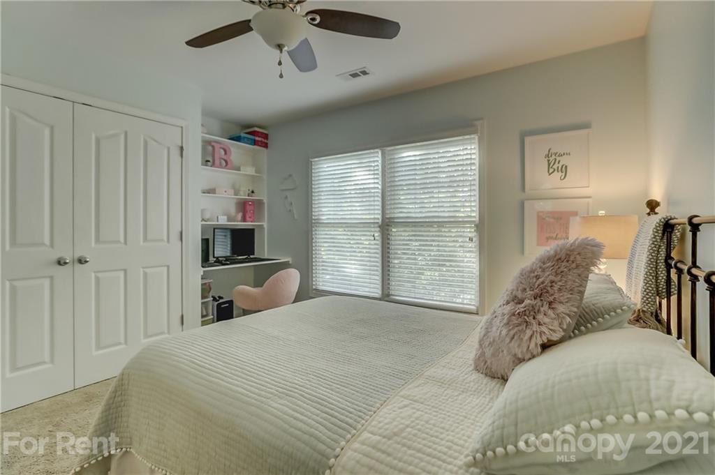 1033 Market Street Fort Mill, SC 29708 - Photo 32 of 46 a bed sitting in a bedroom next to a window