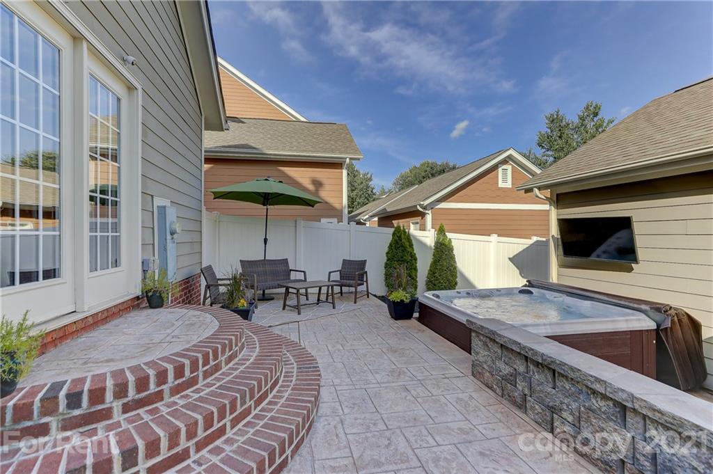 1033 Market Street Fort Mill, SC 29708 - Photo 33 of 46 a view of a patio with table and chairs with wooden floor and fence