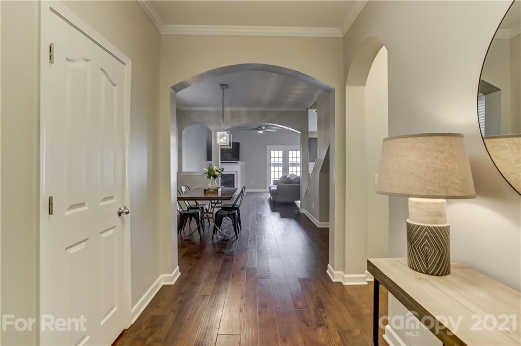 1033 Market Street Fort Mill, SC 29708 - Photo 5 of 46 a view of a hallway view with wooden floor and furniture