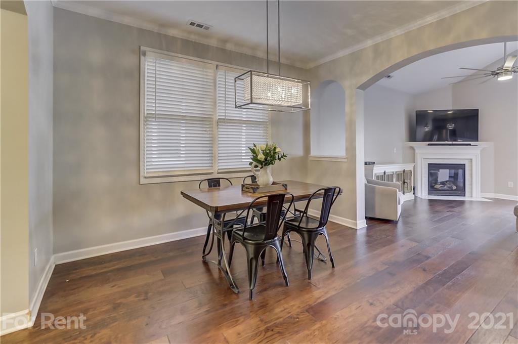 1033 Market Street Fort Mill, SC 29708 - Photo 6 of 46 a view of a dining room with furniture window and wooden floor