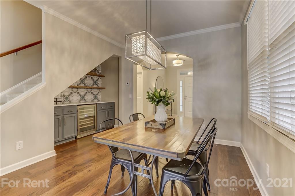 1033 Market Street Fort Mill, SC 29708 - Photo 7 of 46 a view of a dining room with furniture and wooden floor