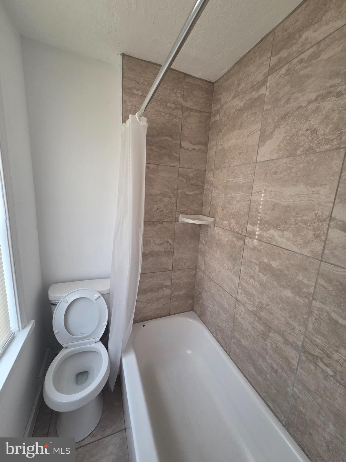 6736 Vandike Street Philadelphia, PA 19135 - Photo 15 of 18 a bathroom with a sink and a tub