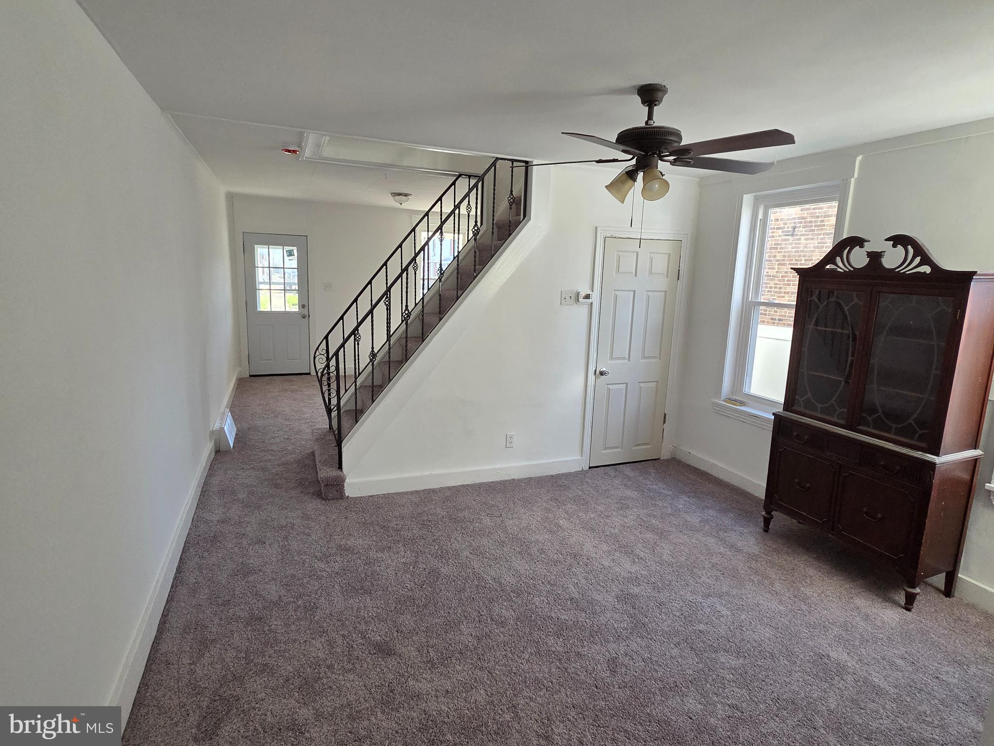 6736 Vandike Street Philadelphia, PA 19135 - Photo 8 of 18 a view of a livingroom with a staircase