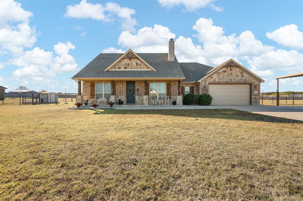 6033 Berry Ridge Lane Joshua, TX 76058 - Photo 1 of 39 a front view of a house with swimming pool and ocean view