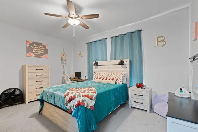 a bedroom with a bed and a closet