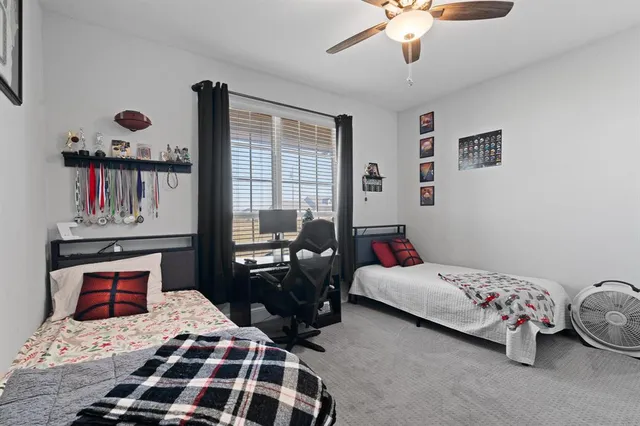 a bedroom with furniture and a window