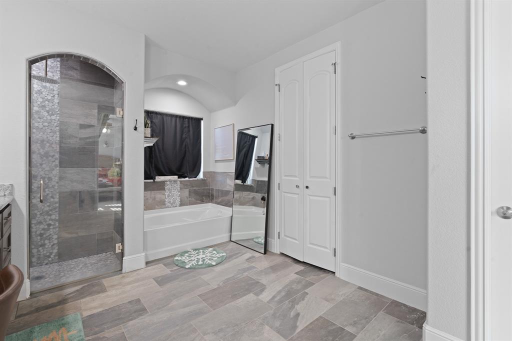 6033 Berry Ridge Lane Joshua, TX 76058 - Photo 19 of 39 a bathroom with a glass shower door and a glass door