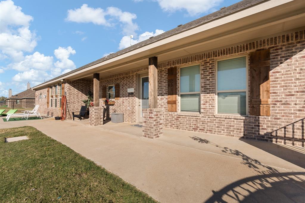 6033 Berry Ridge Lane Joshua, TX 76058 - Photo 24 of 39 a front view of a house with a patio